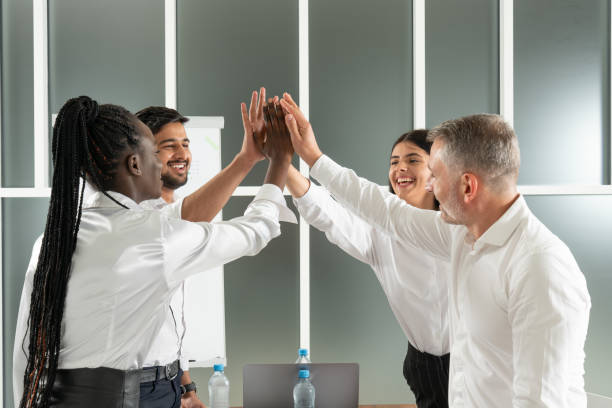istock Millennial businesspeople in office room feel gratification from solving business issues reached corporate goals 1298398406