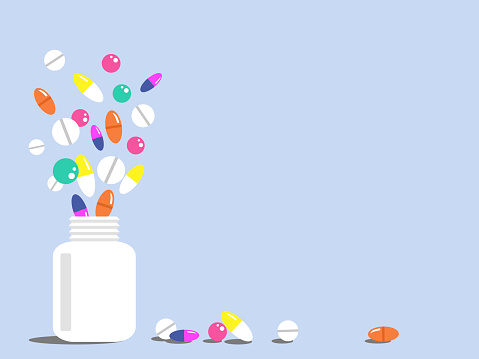 Vector graphics - a white plastic bottle and colorful pills flying out of it on a blue background and space for copying. The concept of health and medicine