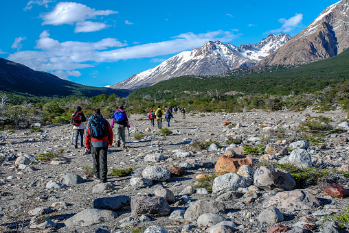 EL CHALTEN, PATAGONIA, ARGENTINA - NOV 3, 2006 : a group of hikers walk along the dry bed of a creek before starting to climb towards Mirador Fitz Roy, near El Chalten