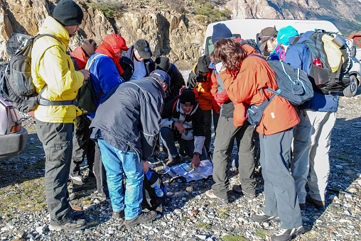 EL CHALTEN, PATAGONIA, ARGENTINA - NOV 3, 2006 : a group of hikers study the map before leaving for Fitz Roy, near El Chalten