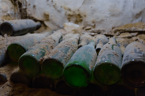 old wine bottles in a dust