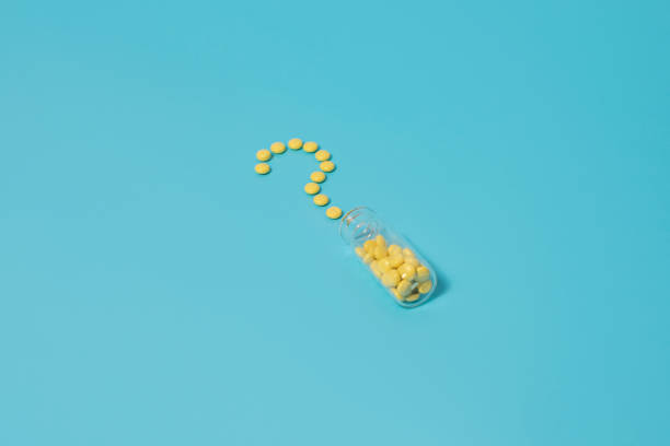 istock Valerian sedative pills in question shape on blue background 1298404783