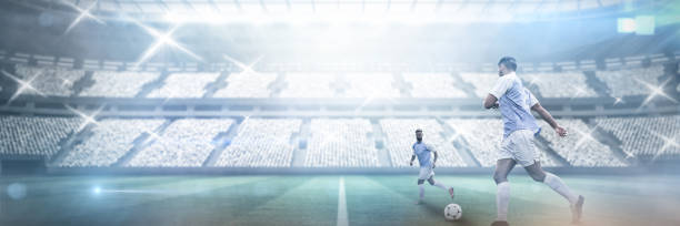 istock Composite image of teamates playing football 1298414941