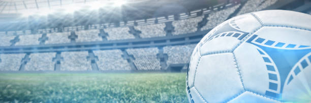 istock Composite image of soccer ball on white marking line 1298415605