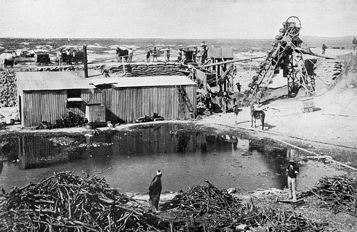 Industrial mining sluice at a diamond mine in Kimberley, South Africa. Vintage photo etching circa 19th century.