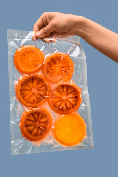istock vacuum sealed bag with orange fruit slices 1298415791