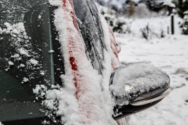 istock a little cleared red car with snow on it 1298416072