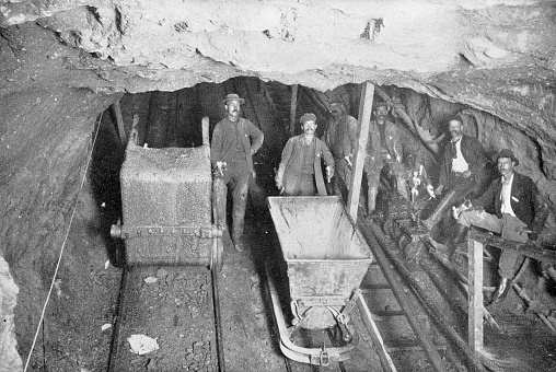 Miners working at Simmer & Jack gold mine in Germiston, South Africa. Vintage photo etching circa 19th century.