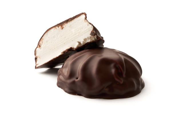 istock Close-up marshmallows and one half covered with chocolate isolated on white background 1298420655