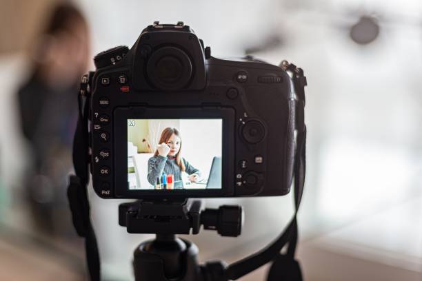 istock A beautiful vlogger records her cosmetics vlog online while sitting at home. 1298420681