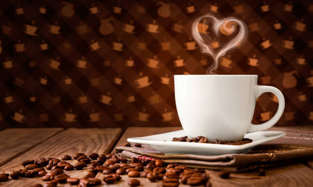 istock Cup of coffee with smoke and coffee beans 1298422727