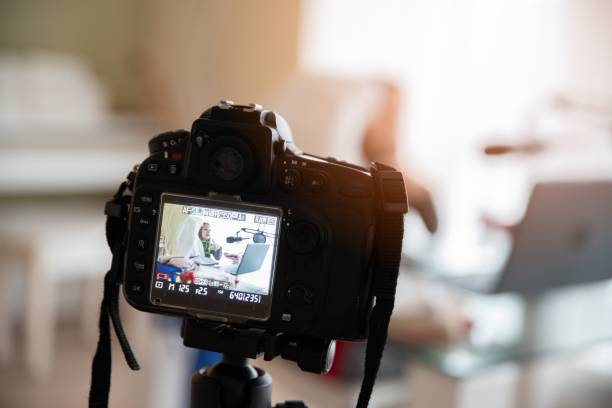 istock Young influencer recording make-up tip videos for her blog. 1298422736