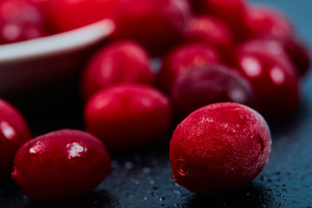 istock Ripe cornel berries on dark background. Close up 1298424579