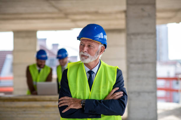 istock An experienced architect at the construction site with hands crossed. 1298429933