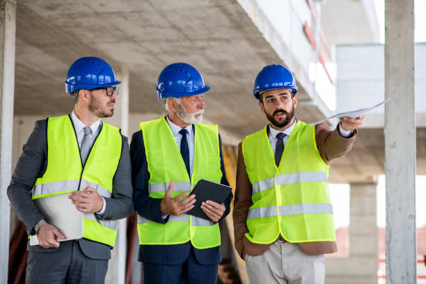 istock Teamwork gives the best results. Three engineers on construction site. 1298430138