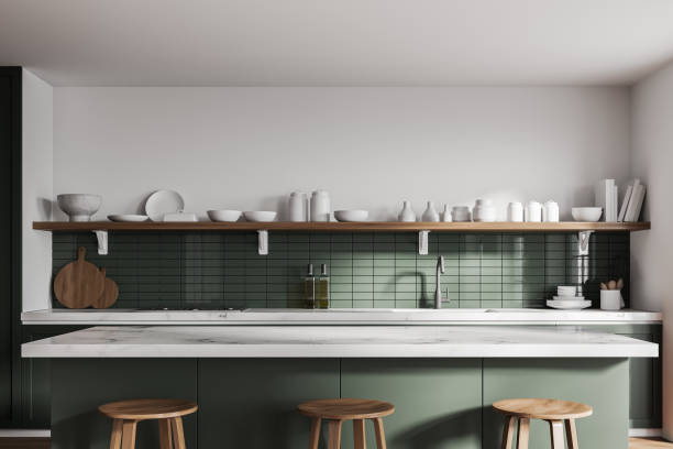 istock White and green kitchen interior with cupboards, close up 1298433789
