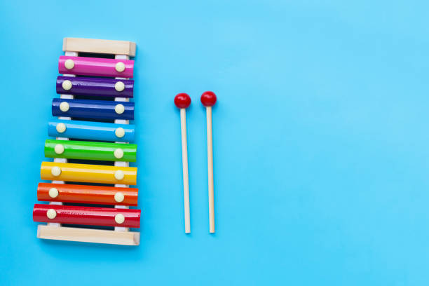 istock Colorful xylophone on yellow background. 1298436769