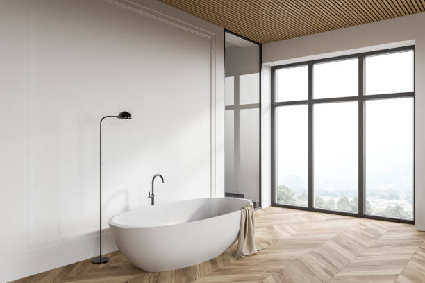 istock White loft bathroom corner with bathtub and shower 1298437506