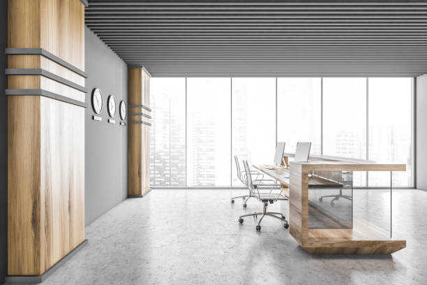 istock Gray and wooden office interior with reception, side view 1298437890