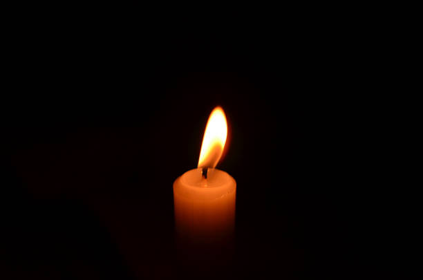 istock Berlin, Germany - October 12, 2013: Candle in the dark 1298437989