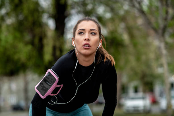istock Active young woman is taking short break before she starts her jogging tour. 1298439791