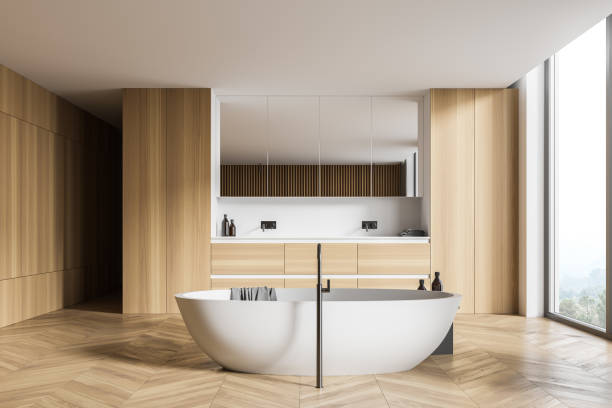 istock Wooden bathroom interior with tub and sink 1298440945