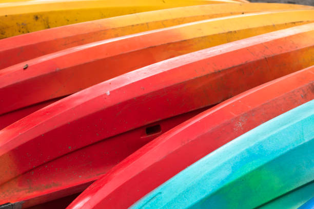 istock Stacked colorful kayaks 1298446605