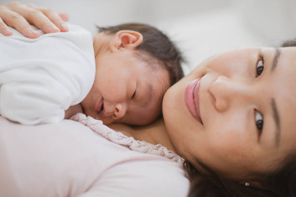 istock Mother and newborn baby 1298448676