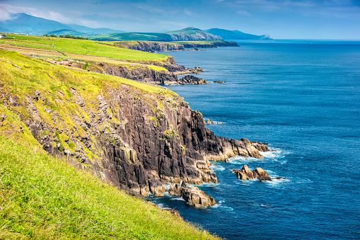 Landscape stock photograph of rugged coastline at Slea Head, Dingle Peninsula, Ireland on a sunny day