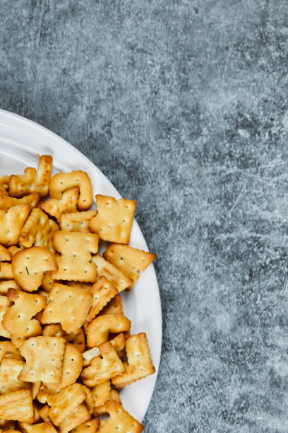 istock A plate of alphabet crackers on a marble background 1298454729