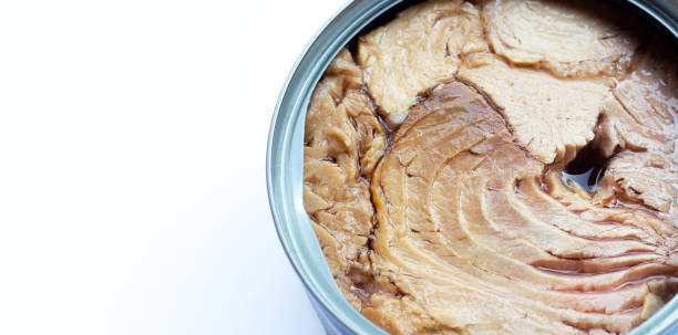 istock Canned tuna fish on white background. 1298456875