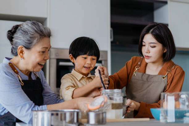istock Asian Chinese family preparing dough for baking at kitchen together 1298463147