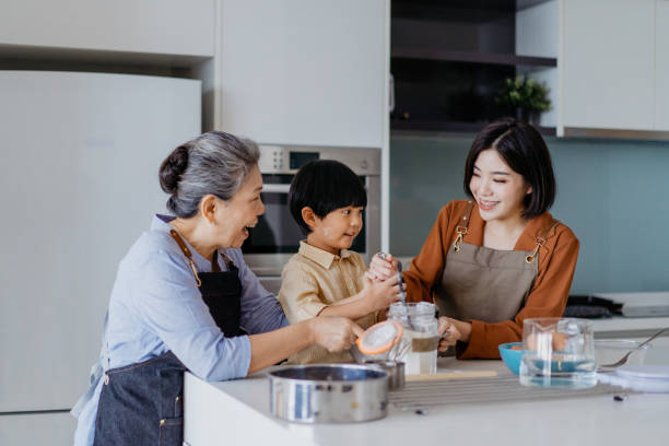 istock Asian Chinese family preparing dough for baking at kitchen together 1298465488