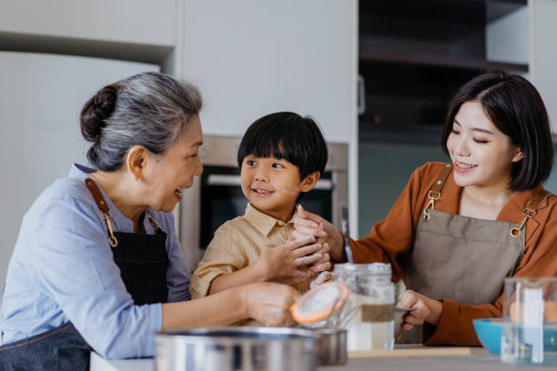 istock Asian Chinese family preparing dough for baking at kitchen together 1298465489