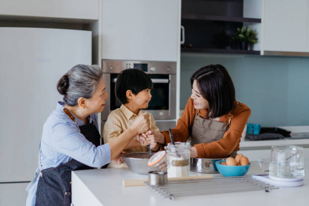 istock Asian Chinese family preparing dough for baking at kitchen together 1298465490