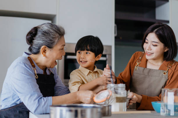 istock Asian Chinese family preparing dough for baking at kitchen together 1298465492