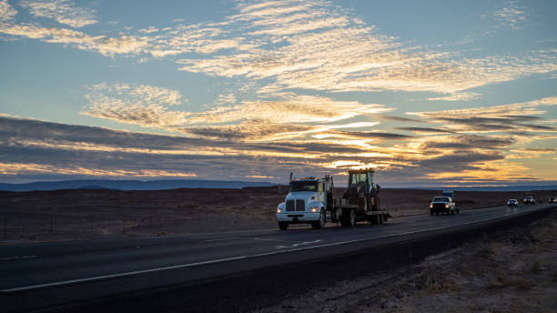 a semi truck moves down a highway
