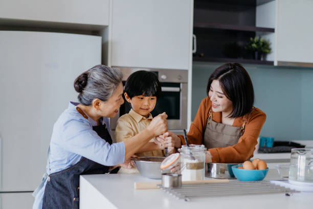 istock Asian Chinese family preparing dough for baking at kitchen together 1298471827
