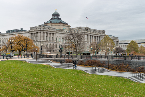 Washington DC, USA - November 30, 2019: People walking nearby Congress Library on the Capitol Hill in Washington, DC