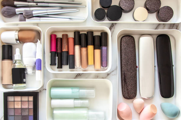 Woman hands neatly placing cosmetic and vanity items in MUJI's PP makeup storage boxes