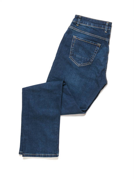 istock Folded blue jeans isolated on a white background. Flat lay. 1298475385