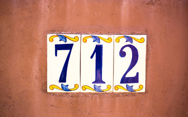 Ceramic Number 712 Street Address Tiles, Orange Wall Ceramic Number 712 Street Address Tiles, Orange Wall ceramic tile house numbers stock pictures, royalty-free photos & images