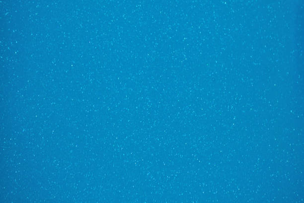 istock Blue monochrome background with small silvery sparkles with a gradient along the edges. 1298480368