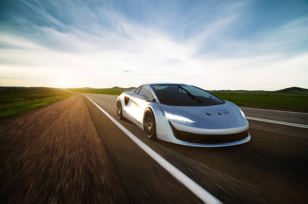 istock gray sportscar driving on a road 1298482996
