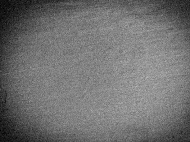 istock Abstract gradient dark gray color background with noisy surface 1298490369