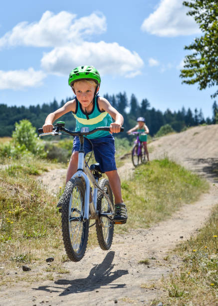 istock Boy jumping bike 1298498275