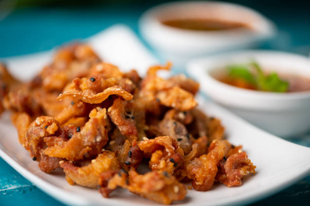 istock Crispy fried sliced belly pork with spicy sauce 1298499388
