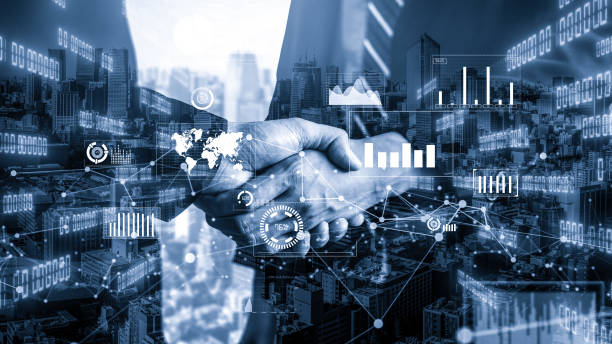 istock Imaginative visual business handshake with computer graphic of investment data 1298501872