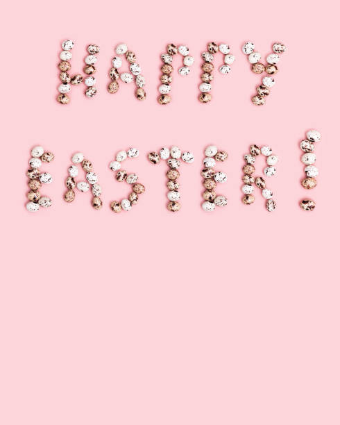 istock Words  Happy Easter from Chocolate Quail eggs on pastel background. Small pink egg, spring Easter holiday 1298503569