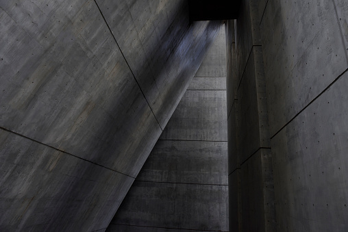 Abstract dark concrete wall architecture detail.